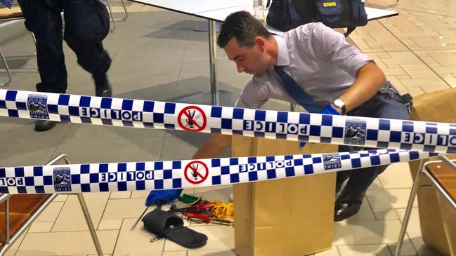 Police remove evidence from Brisbane International Airport. Picture: AAP/Sarah Marshall 