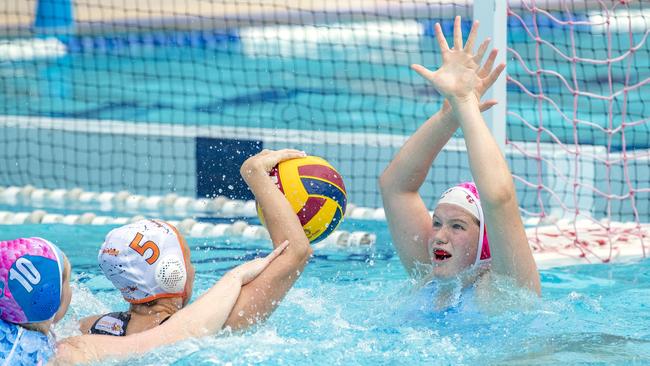 Goalie Victoria Kininmonth and Alice Williams defending Emily Gallagher. Picture: Richard Walker