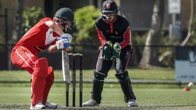 CSB: Mordialloc batter Jordan Barden squeezes one past South Caulfield keeper Elliott Bradley. Picture: Valeriu Campan