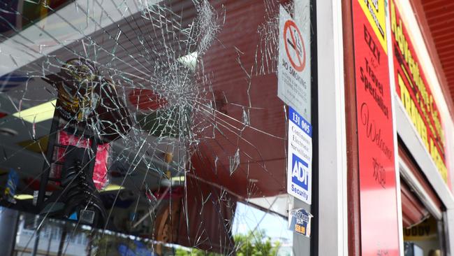 A smashed window at Adventure Cairns and Beyond on Lake St in Cairns CBD. Picture: Brendan Radke