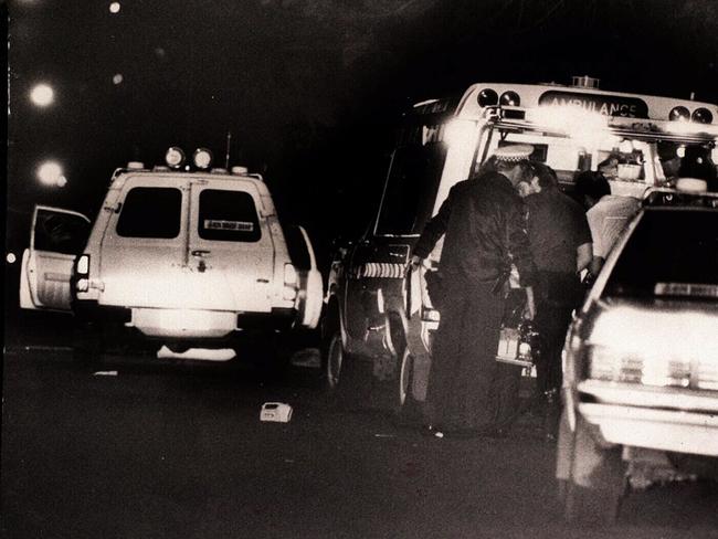 Ambulance officers at the scene of the Walsh Street shooting. Picture: News Limited