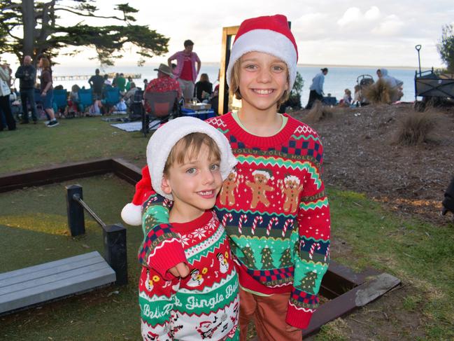 Ned and Archie getting festive at the Phillip Island Christmas Carols by the Bay at the Cowes Foreshore on Tuesday, December 10, 2024. Picture: Jack Colantuono