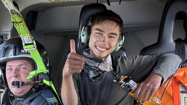 Hiker Hadi Nazari gave a thumbs up after being rescued following 13 days lost in the Kosciuszko National Park. Picture: NSW Police