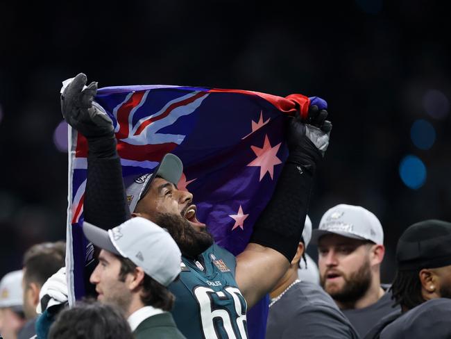 Mailata celebrated with the Aussie and Samoan flags. Picture” Emilee Chinn/Getty Images