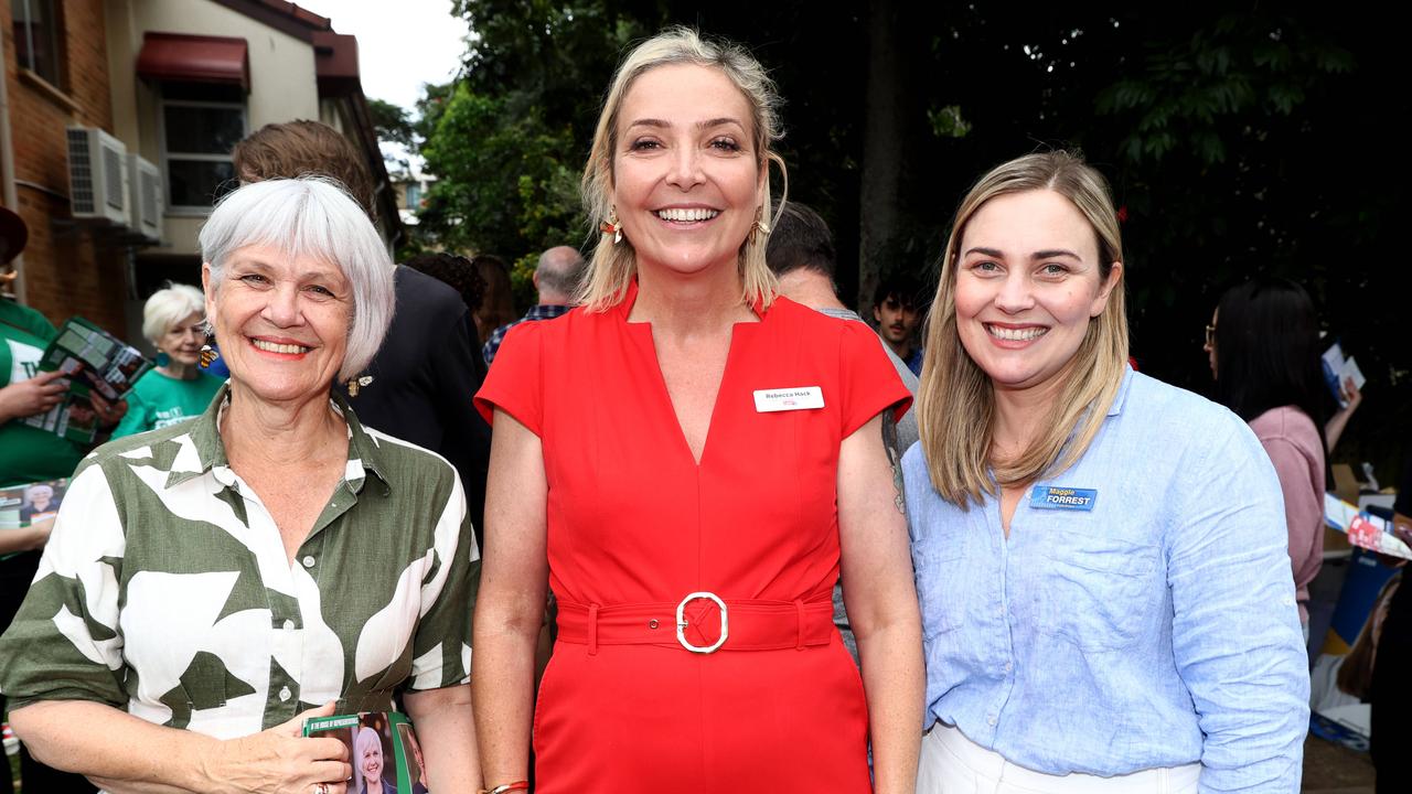 Ryan MP Elizabeth Watson-Brown with opposition candidates Rebecca Hack for Labor and Maggie Forrest for Liberals at a pre-polling venue. Picture: David Clark