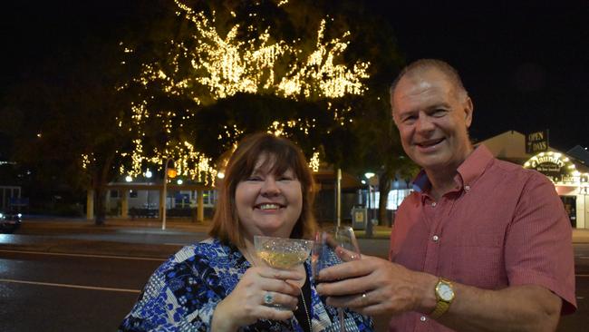 Lady Marmalade Cafe owner Sonja Searle and Our Stones Corner president Michael Weibler toast the switching on of the lights at Stones Corner. Picture: Brian Bennion