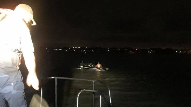 Redland Bay Coast Guard volunteers rescue a family of five from a sinking boat in Redland Bay.