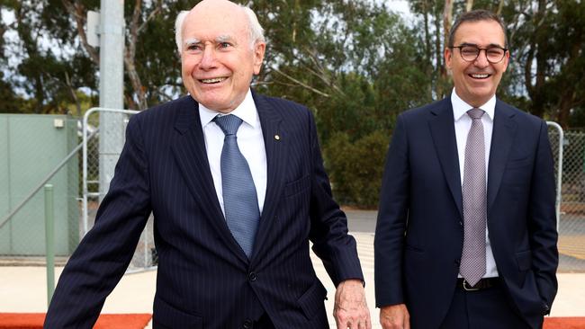 Premier Steven Marshall and former Prime Minister John Howard visiting the Modbury bowls club on Wednesday. Picture: NCA NewsWire / Kelly Barnes