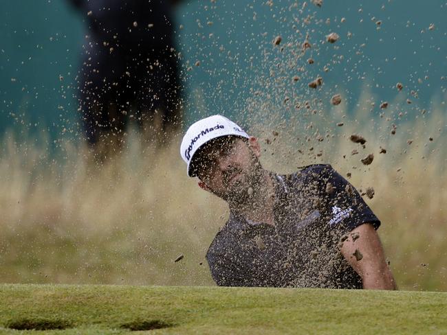 Rhein Gibson of Australia plays out of the bunker on the 18th hole during the third day of the British Open Golf championship. Picture: Alastair Grant