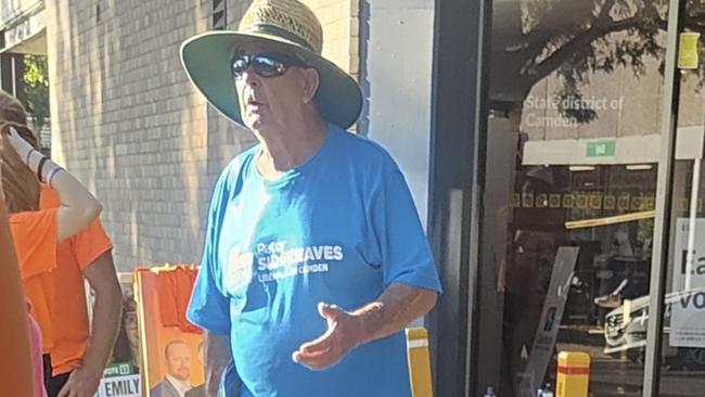 Liberal volunteer John Smith at a polling station in Camden.