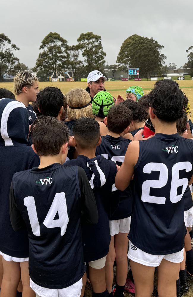 Victorian coach Leigh McQuillen talks to his players.