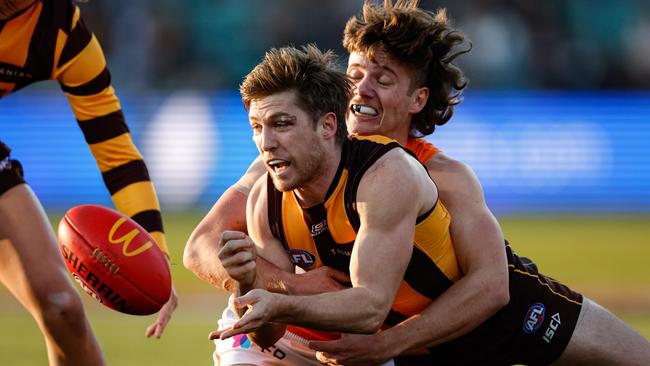 MELBOURNE, AUSTRALIA - JUNE 08: Dylan Moore of the Hawks is tackled by Toby McMullin of the Giants during the 2024 AFL Round 13 match between the Hawthorn Hawks and the GWS GIANTS at UTAS Stadium on June 08, 2024 in Launceston, Australia. (Photo by Dylan Burns/AFL Photos via Getty Images)