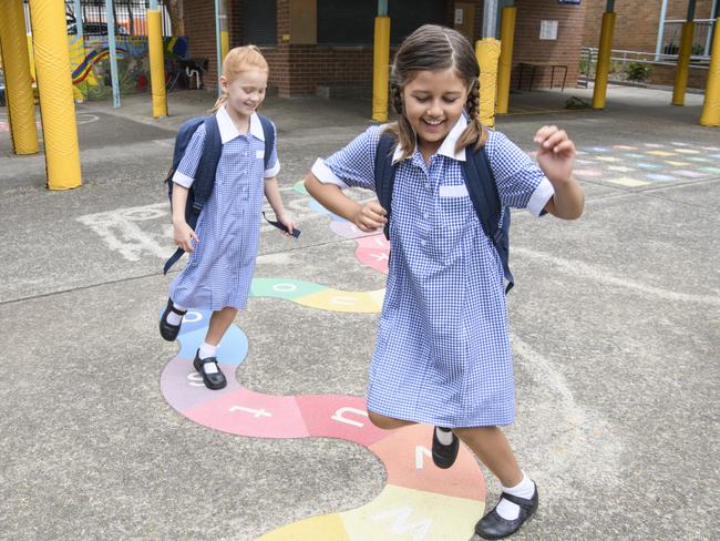 Primary school girls in playground at school.