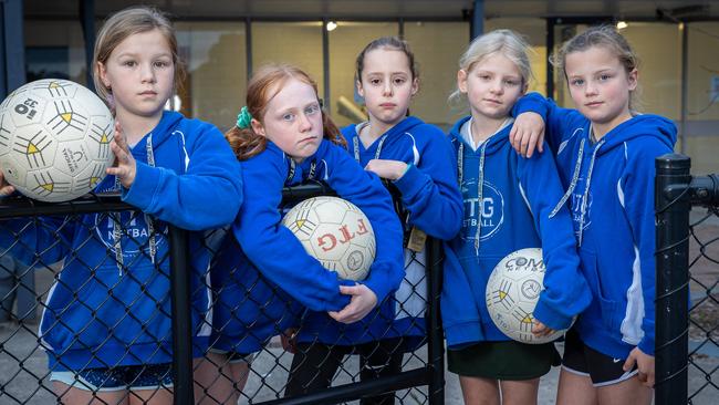 L-R U11 Netball Kiara, 9, Hannah, 10, Sophie, 10, Emily, 9 and Hayden, 9. Under 11 Ferntree Gully netball club can't resume their sport on the weekend due to density limits at indoor stadiums and the outside courts have too many players to go ahead. Picture: Jason Edwards