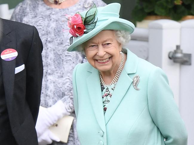 The Queen watches as horses are walked around the parade ring on the fifth day of the Royal Ascot horse racing meet. Picture: AFP