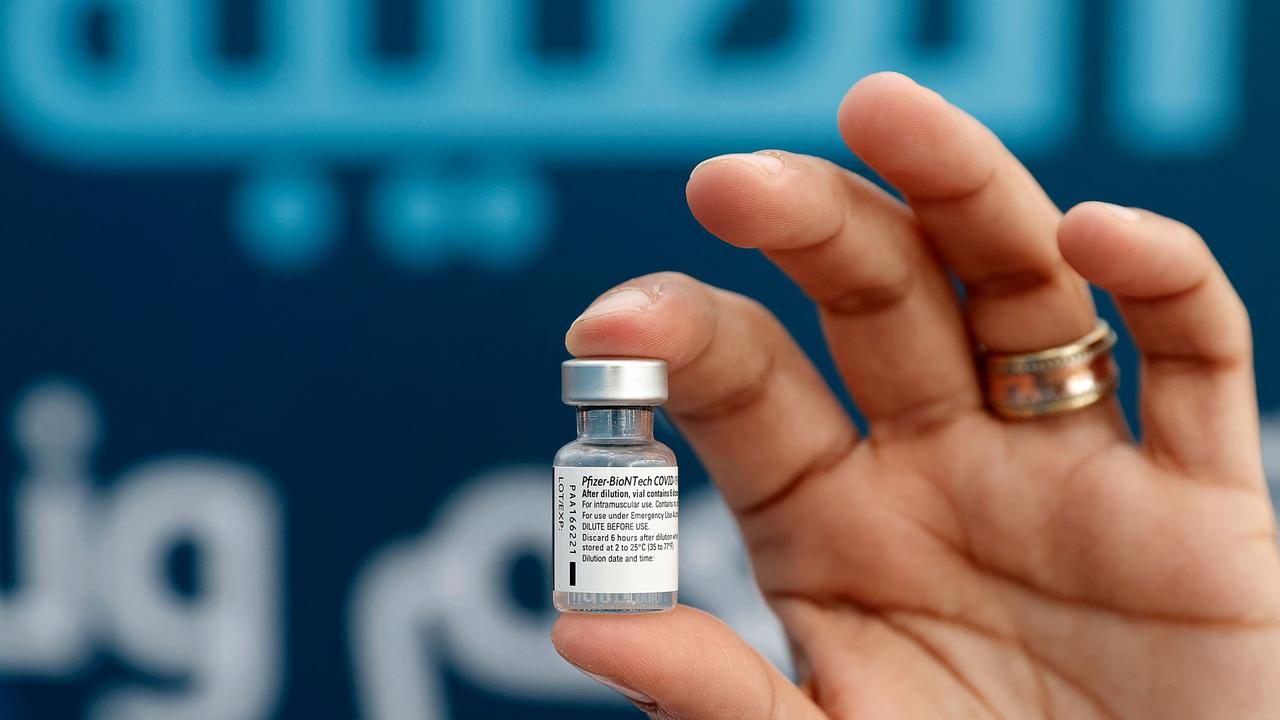 A medic holds up a vial of the Pfizer-BioNTech COVID-19 vaccine at a centre at the Atid al-Najah High School for the Sciences in Taibeh, northern Israel. Picture: Jack Guez/AFP