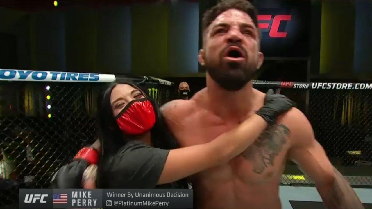 Mike Perry and girlfriend Latory Gonzalez after his victory.