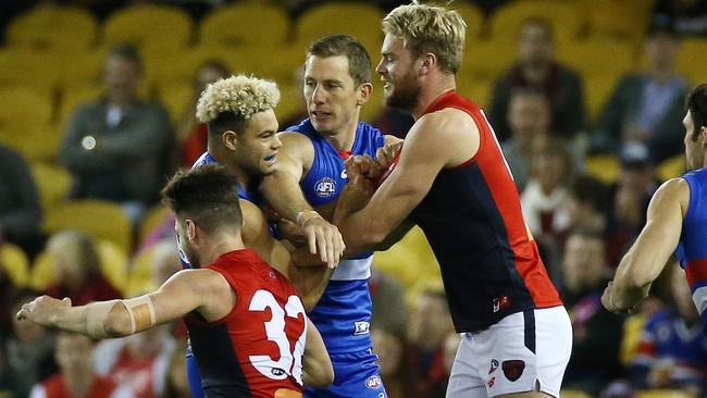 Tom Bugg, Jack Watts and Jason Johannisen get acquainted before the first bounce. Picture: George Salpigtidis