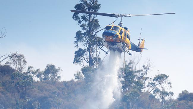 Helicopter dumping water. Bushfire in Dynnyrne threatening homes. Picture: Nikki Davis-Jones