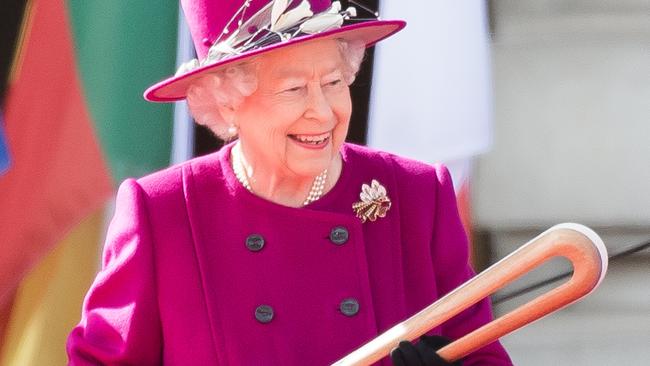 Back in March 2017 in London England, Queen Elizabeth II holds the Commonwealth baton during the launch of The Queen's Baton Relay ahead of the XXI Commonwealth Games that were held on the Gold Coast in 2018. (Picture: Samir Hussein/Samir Hussein/WireImage)