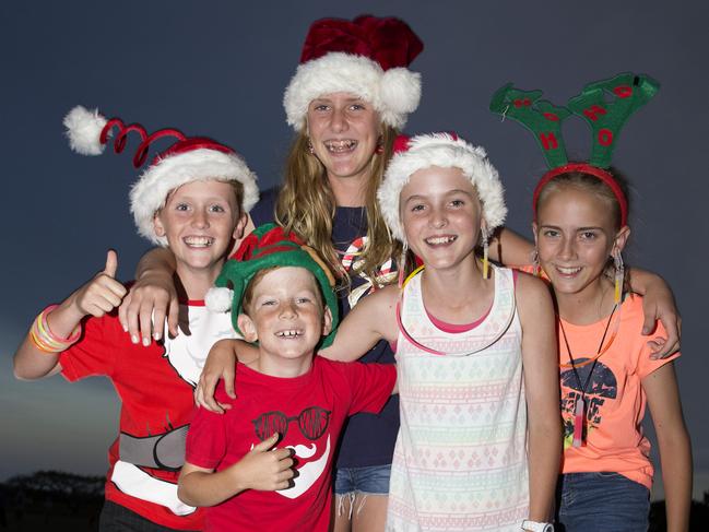 Cameron Richetts, 10, Tommy Touzell, 9, Charlie Richetts, 12, Charli Touzell, 11, and Jade Touzell, 12 attending the Carols by Candlelight at Mudgeeraba. Photo: Jerad Williams