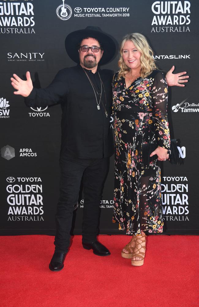 Farriss and his wife Marlina are part of the Tamworth crowd. Picture: AAP Image/Brendan Esposito.