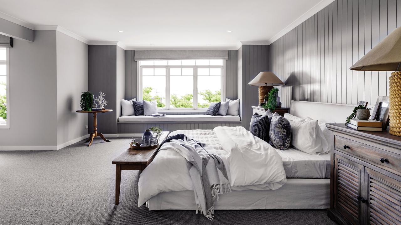 Timber wall panelling and a built-in window seat are part of the main bedroom’s appeal.