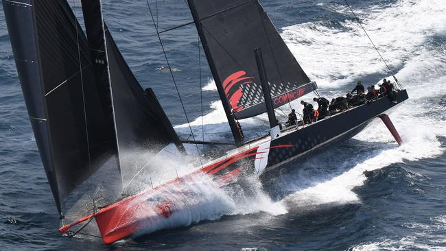 Comanche takes the lead over Info Track as the field makes its way down the coast following the start of the Sydney to Hobart Yacht race in Sydney, Thursday, December 26, 2019. (AAP Image/Dean Lewins)