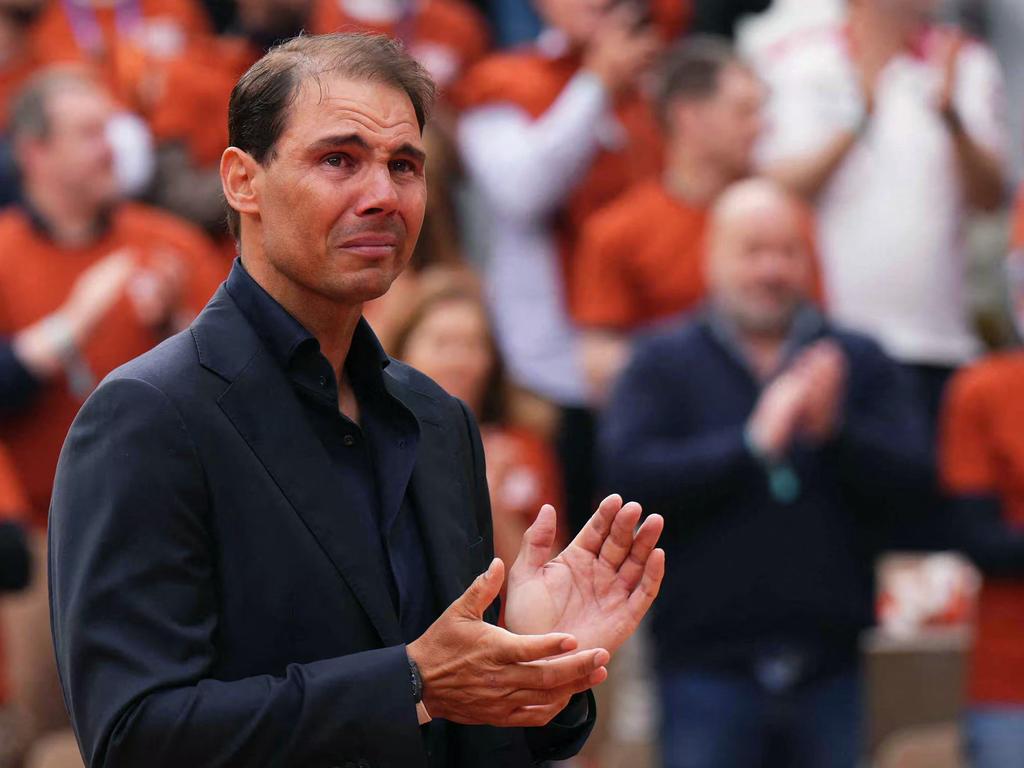 Rafael Nadal applauses during a ceremony honouring his career at the French Open. Picture: Dimitar DILKOFF / AFP