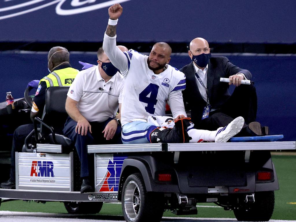 Dak Prescott is carted off the field after sustaining a leg injury against the New York Giants on October 11, 2020. (Photo by Tom Pennington/Getty Images)