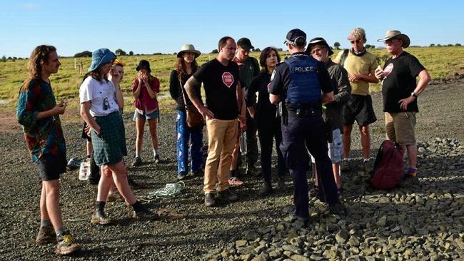 NSW Greens MPs Jeremy Buckingham and Dawn Walker were arrested by Queensland police after taking part in a blockade of the Adani Carmichael coal mine rail construction site at Belyando, 270km west of Bowen.