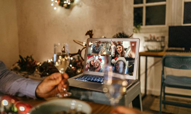 Laptop screen with family video chatting online on the occasion of Christmas celebration