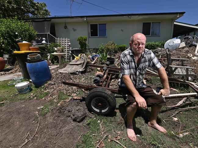 17/11/2020: Kyle Enright, son and carer of Maureen Enright, in the junk strewn front yard, as left by the police after a search, of their home in Inala, Brisbane. Maureen Enright is accused of murdering her infant son over 50 years ago.  Pic Lyndon Mechielsen