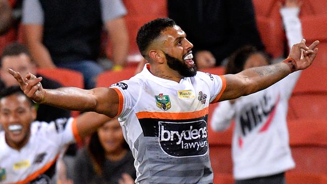 Joshua Addo-Carr of the Tigers celebrates scoring a try.