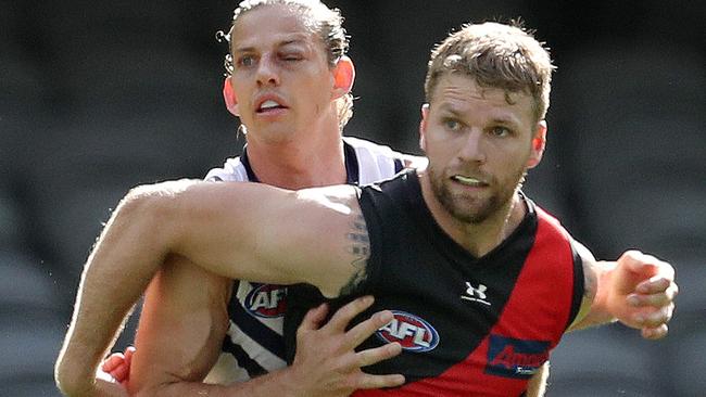 AFL Round 1. Essendon v Fremantle at Marvel Stadium..  21/03/2020.  Jake Stringer of the Bombers and Nat Fyfe of the Dockers    . Pic: Michael Klein