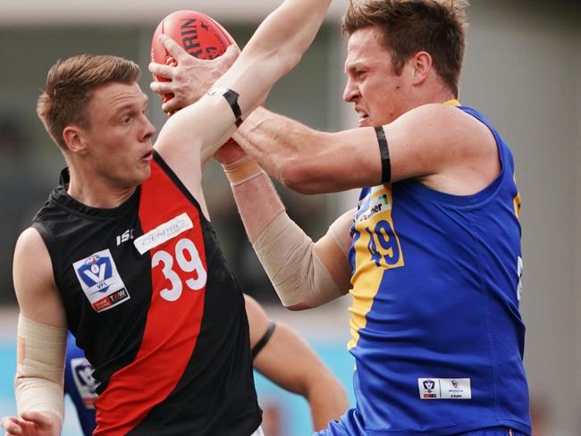 Nick Meese of Williamstown gathers the ball from Trent Mynott of Essendon during the VFL Preliminary Final match between Williamstown and Essendon at Adcon Stadium in Melbourne, Sunday, September 15, 2019.  (AAP Image/Michael Dodge) NO ARCHIVING, EDITORIAL USE ONLY