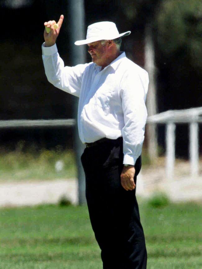 OUT: Barry Moyse umpiring cricket match while on home detention. 