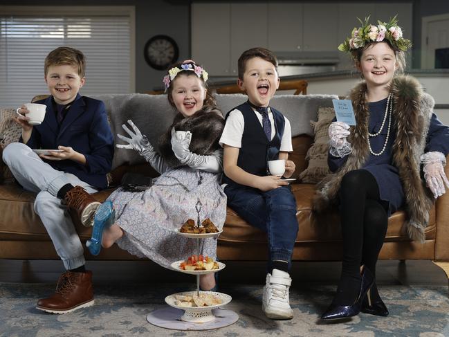 Older siblings can be fantastic helpers when it comes to building better literacy at home – especially by modelling behaviour that embraces mistakes. Siblings Oscar, 10, Bella, 4, Charlie, 7, and Jazmine, 8, have been taught by their mum Samantha Taylor to play with language rather than learn it by rote. Picture: Alex Coppel.