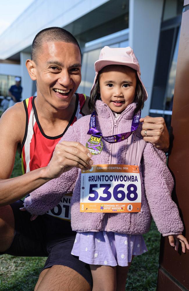 5km finisher Emmanuel Vergara with his daughter Juno as she prepares to run her first ever run as part of the Toowoomba Marathon events at Wellcamp Airport, Saturday, May 3, 2025. Picture: Kevin Farmer