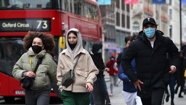 People rush to get to shops on London’s Oxford Street as they reopen after coronavirus restrictions ease. Picture: Getty Images