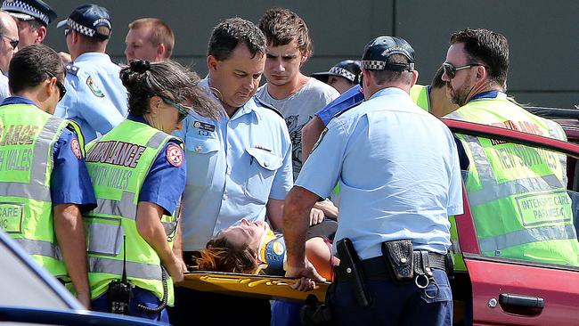 Paramedics treated motorists at the scene after two cars were struck by the stolen vehicle and two cars travelling north also collided as they braked for safety. Picture: Mike Batterham