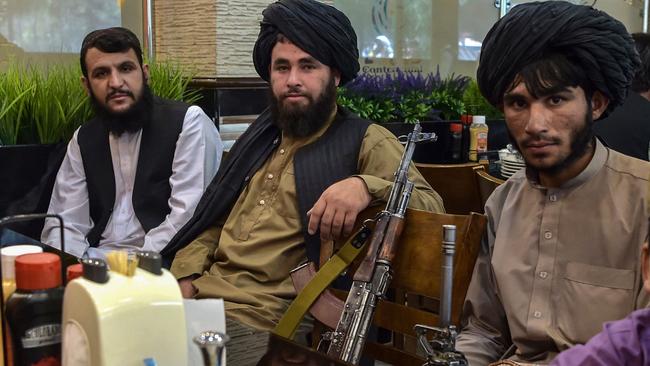 Taliban fighters at a restaurant in Kabul. Picture: AFP