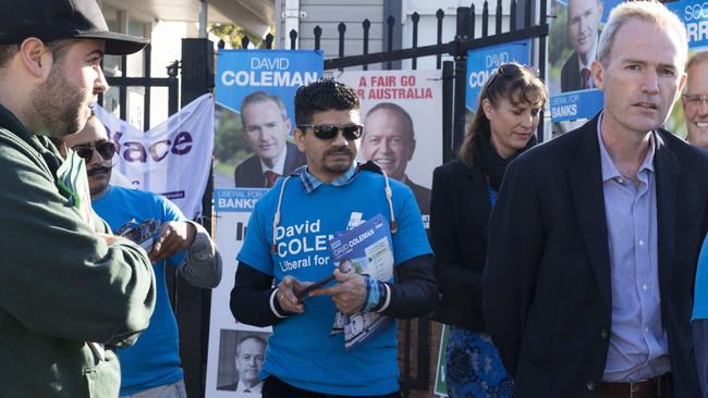 Greens volunteer Shane Bazzi questions Liberal MP and Minister for Immigration David Coleman at Panania North Public School. Picture: Matthew Vasilescu