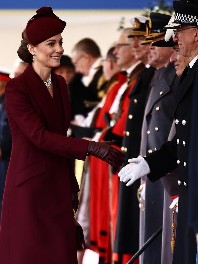 The princess was typically chic in a burgundy Alexander McQueen coat dress. Picture: Henry Nicholls-WPA Pool/Getty Images