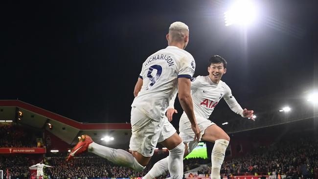 Richarlison (left) opens the scoring against Forest and celebrates with teammate Son Heung-min. (Photo by Michael Regan/Getty Images)