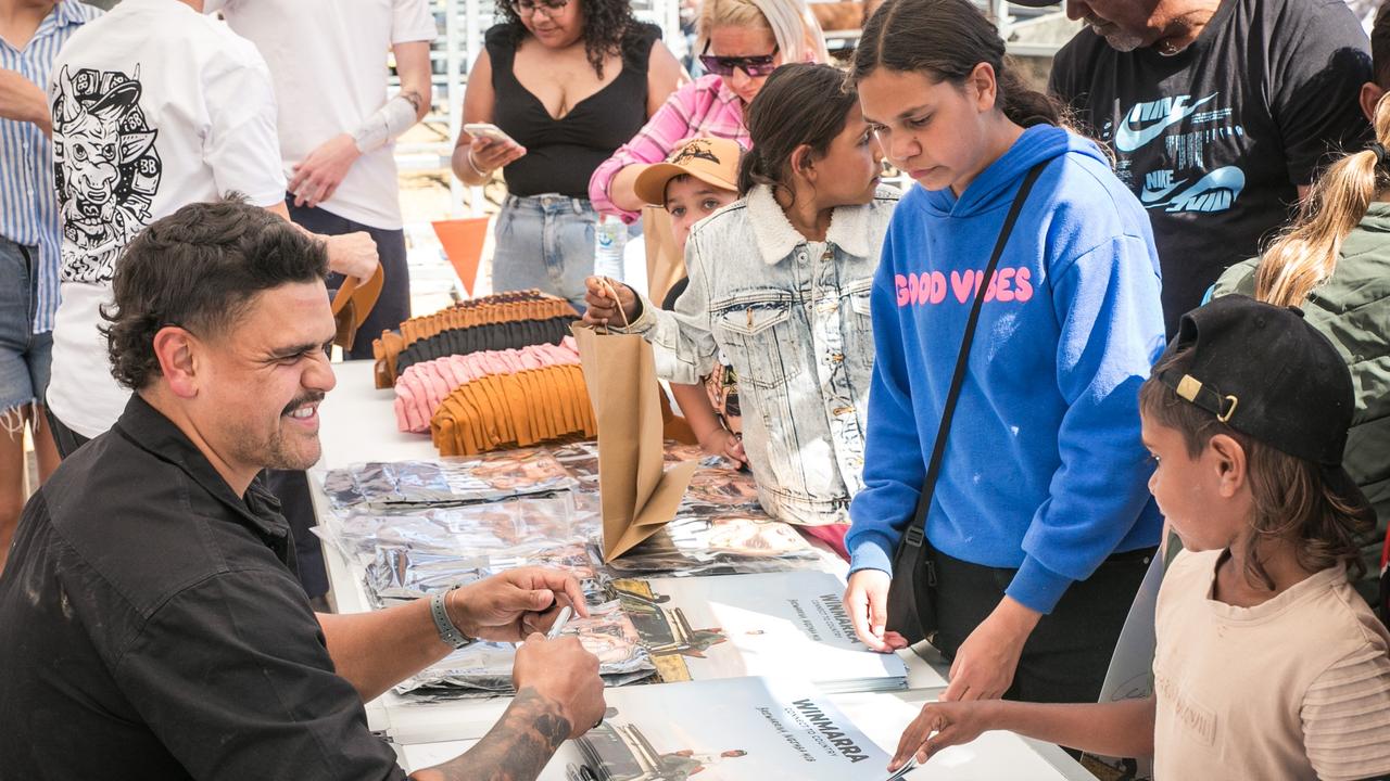 Latrell Mitchell signing autographs at the event in Brewarrina. Picture supplied