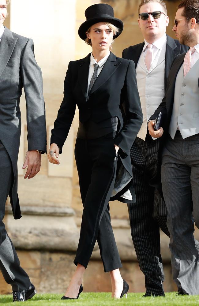 Cara Delevingne (2nd L) arrives ahead of the wedding of Princess Eugenie of York and Mr. Jack Brooksbank at St. George’s Chapel on October 12, 2018 in Windsor, England. (Photo by Adrian Dennis - WPA Pool/Getty Images)