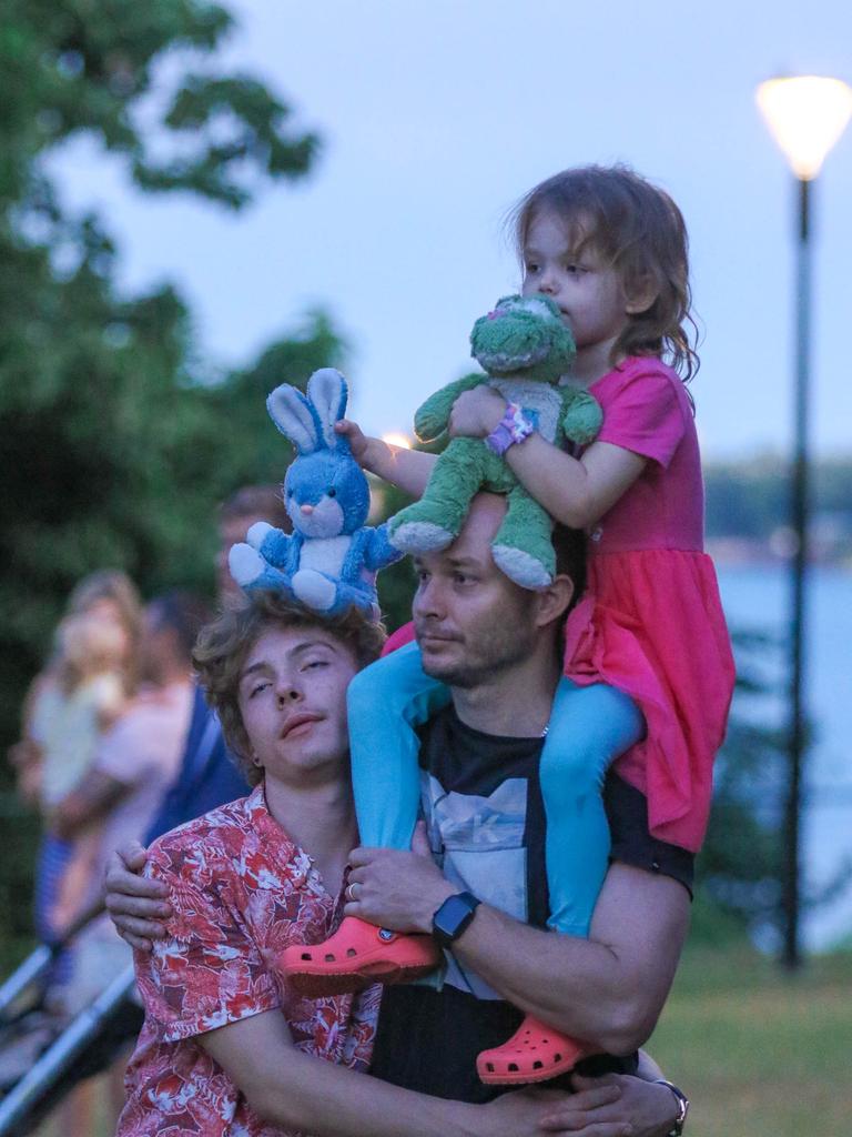 Cooper McLaurin (L) and Ryan and Chloe Clements at The Dawn Service at Darwins Cenotaph commemorating ANZAC Day 2021. Picture Glenn Campbell