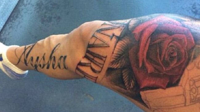 The leg features the name ‘Aysha’, the word ‘millionaire’ and a hand gun and a rose. Picture: Bondi Ink.