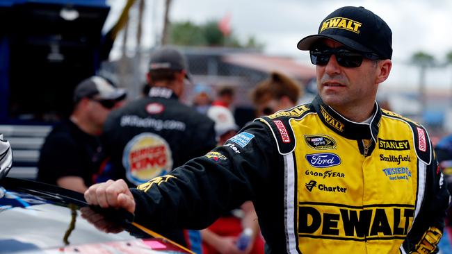 Marcos Ambrose stands on the grid before the start of the NASCAR Sprint Cup Series Coke Zero 400 at Daytona International Speedway in 2014. Picture: Scott Halleran/Getty Images